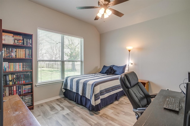 bedroom featuring light hardwood / wood-style floors, multiple windows, and ceiling fan