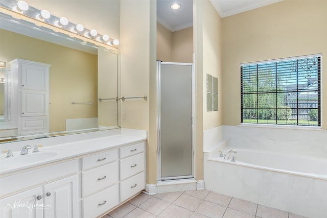 bathroom with independent shower and bath, vanity, and tile patterned floors