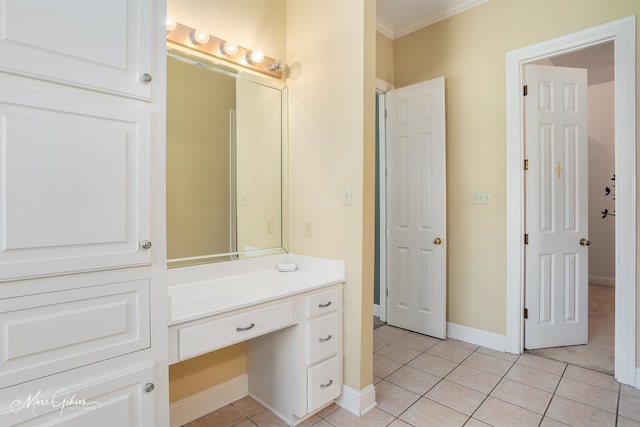 bathroom featuring ornamental molding, tile patterned flooring, and vanity