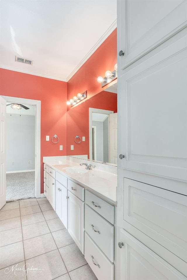 bathroom featuring ornamental molding, tile patterned flooring, ceiling fan, and vanity