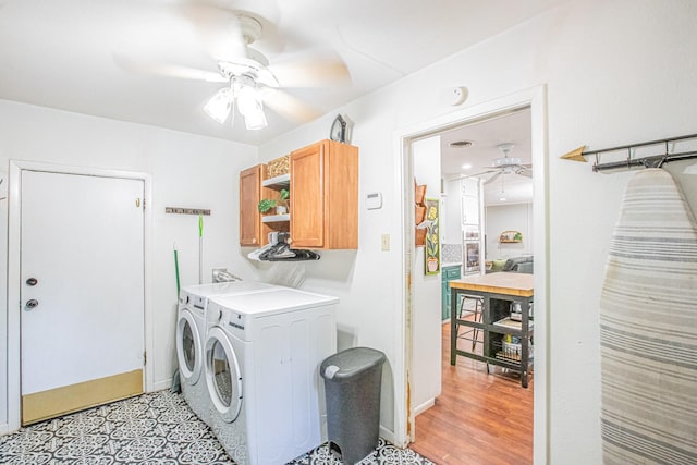 laundry room featuring separate washer and dryer, cabinets, ceiling fan, and light hardwood / wood-style floors