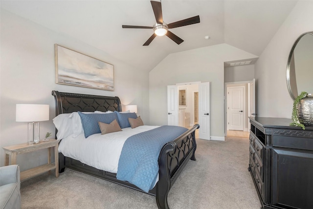 carpeted bedroom featuring ceiling fan, connected bathroom, and vaulted ceiling