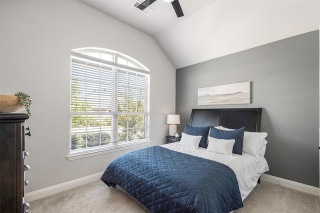 bedroom featuring carpet, vaulted ceiling, multiple windows, and ceiling fan