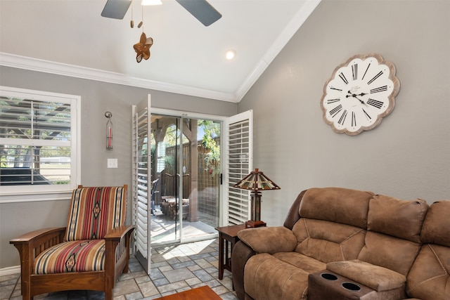 living room featuring lofted ceiling, ceiling fan, and crown molding