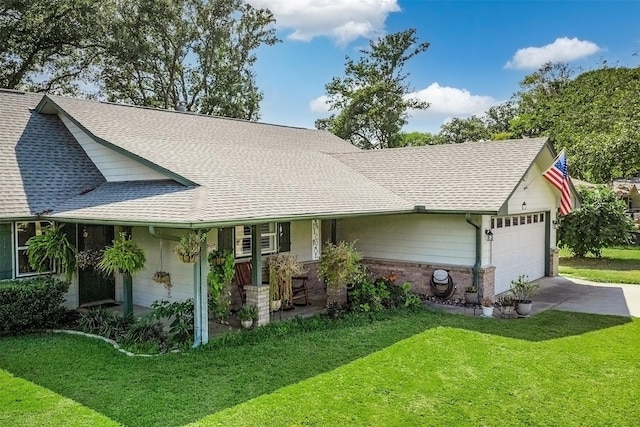 ranch-style home with a front yard and a garage