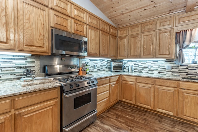 kitchen with appliances with stainless steel finishes, tasteful backsplash, and wooden ceiling