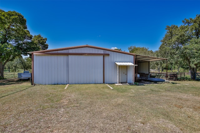 view of outdoor structure with a yard