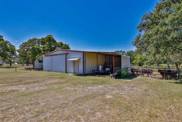 view of outbuilding featuring a yard