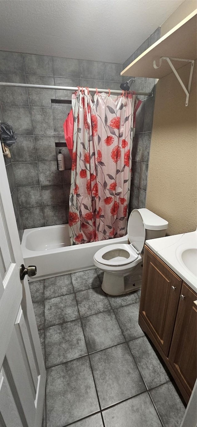 full bath with shower / tub combo with curtain, vanity, toilet, and tile patterned flooring