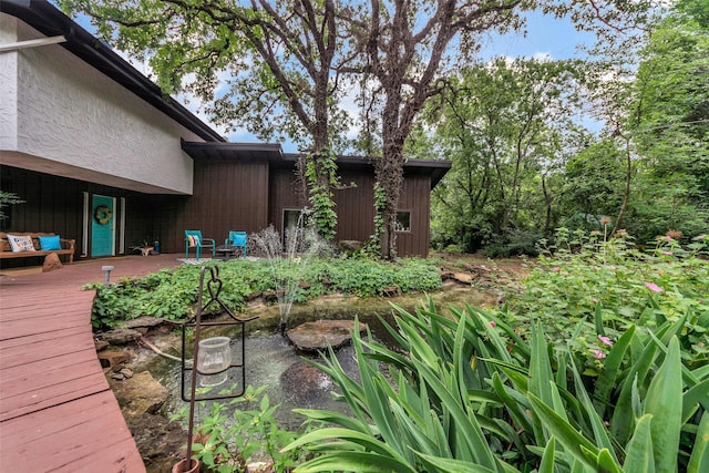 view of yard featuring a wooden deck