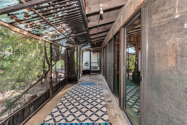 unfurnished sunroom featuring plenty of natural light