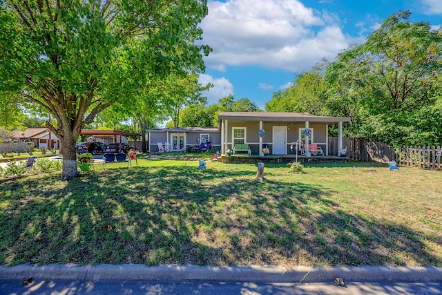 ranch-style home with a front lawn and covered porch