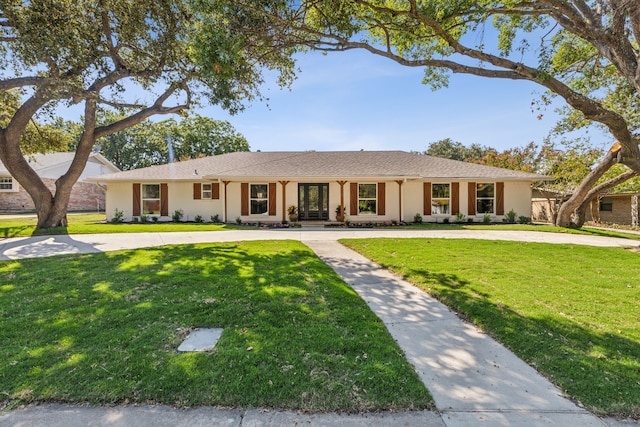 single story home featuring a front lawn and covered porch