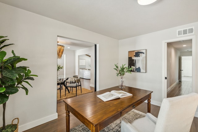 dining room with dark wood-type flooring