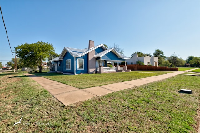 view of front of property with a front lawn