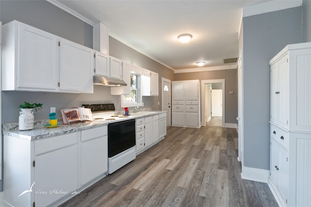 kitchen with hardwood / wood-style flooring, sink, white cabinetry, white range with electric stovetop, and crown molding