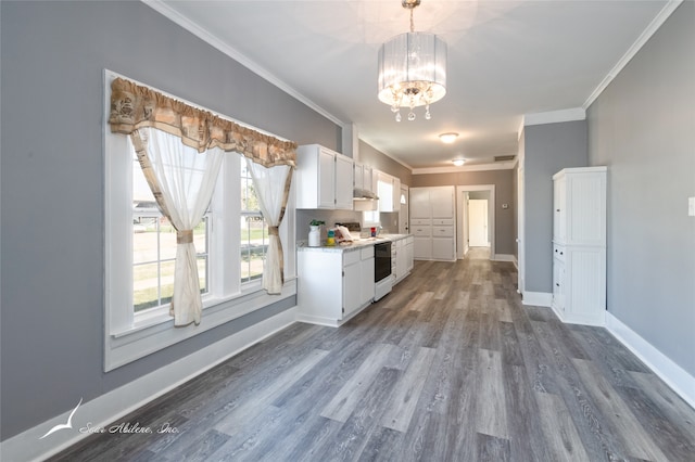 kitchen featuring ornamental molding, white cabinetry, white electric range, a notable chandelier, and hardwood / wood-style floors