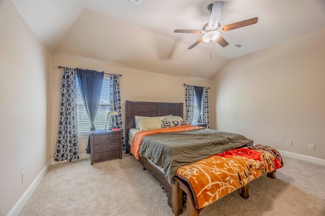 bedroom with ceiling fan, carpet floors, and lofted ceiling