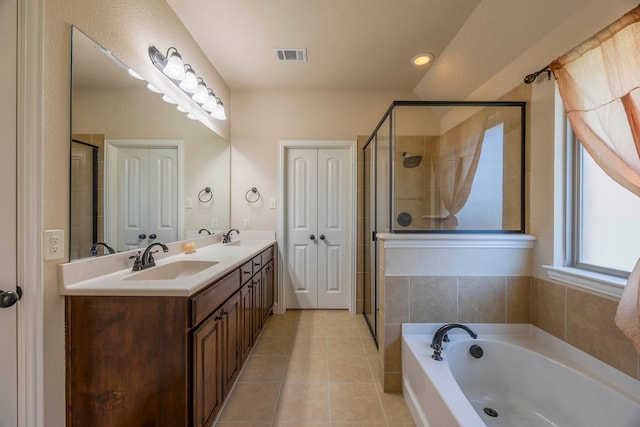 bathroom with independent shower and bath, tile patterned flooring, and vanity