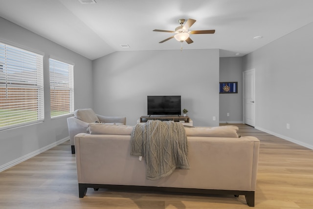 living room featuring light wood-type flooring, lofted ceiling, and ceiling fan