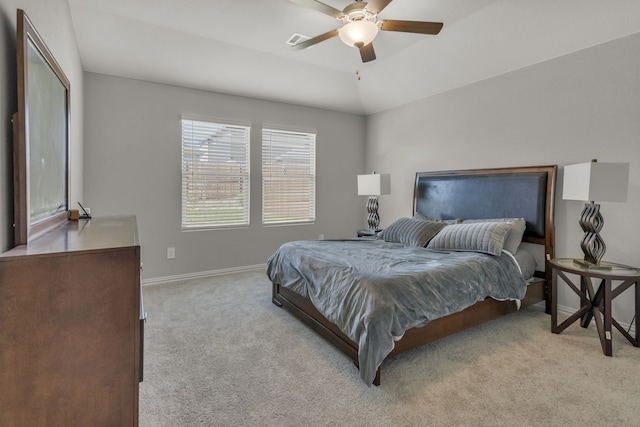 carpeted bedroom featuring ceiling fan and vaulted ceiling