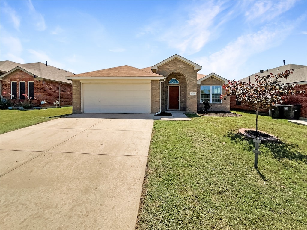 ranch-style home featuring a front yard and a garage