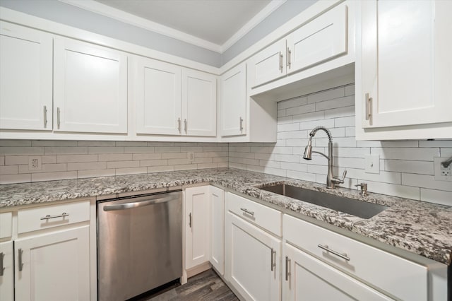 kitchen with decorative backsplash, white cabinetry, dishwasher, ornamental molding, and sink