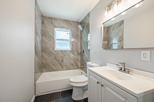 full bathroom featuring tile patterned flooring, vanity, toilet, and tiled shower / bath