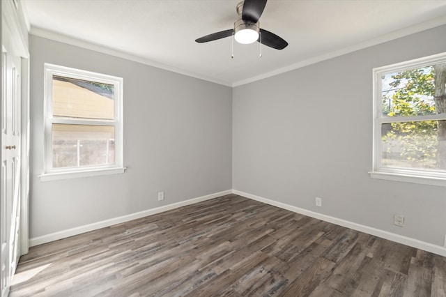 empty room featuring crown molding, dark hardwood / wood-style floors, and ceiling fan