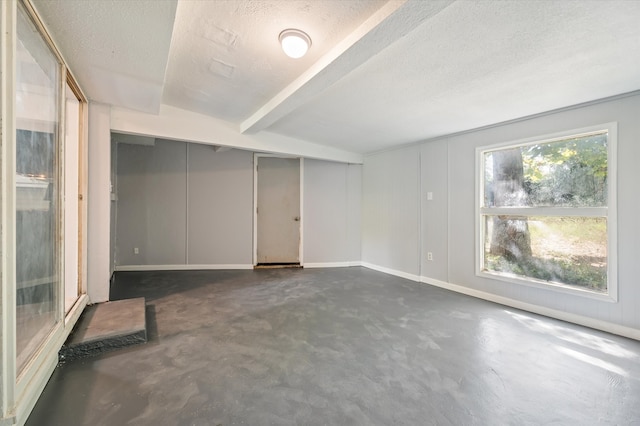 empty room featuring a textured ceiling