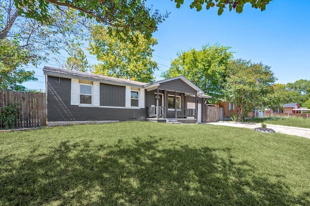 ranch-style home featuring a front yard and a porch