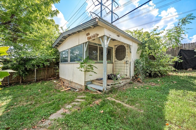 view of outdoor structure with a lawn