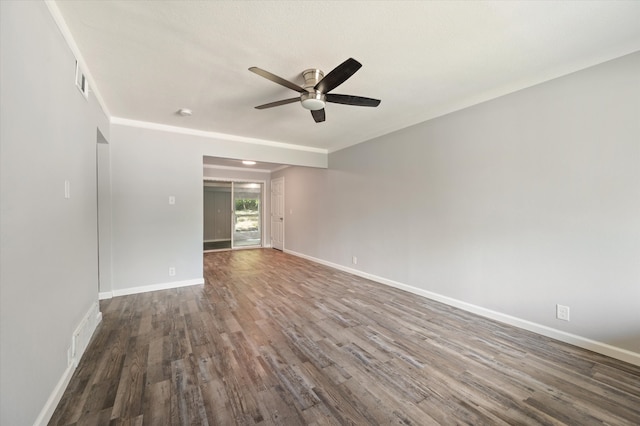 empty room with ceiling fan and dark wood-type flooring