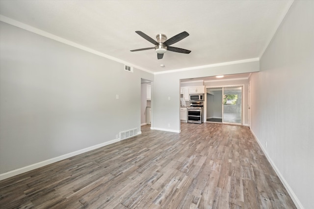 unfurnished living room featuring light hardwood / wood-style floors, ceiling fan, and crown molding