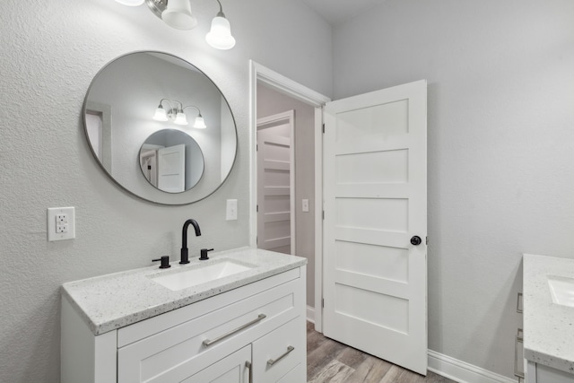 bathroom featuring vanity and hardwood / wood-style flooring