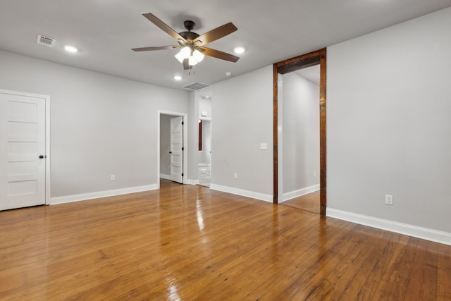 unfurnished room featuring hardwood / wood-style floors and ceiling fan