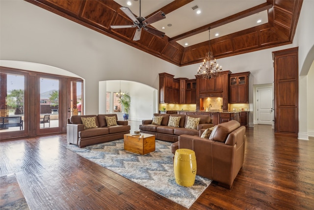 living room featuring beamed ceiling, sink, high vaulted ceiling, ceiling fan with notable chandelier, and dark hardwood / wood-style flooring