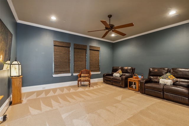 living area featuring ceiling fan, light carpet, and ornamental molding