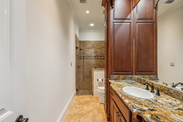 bathroom featuring vanity, tile patterned flooring, walk in shower, crown molding, and toilet