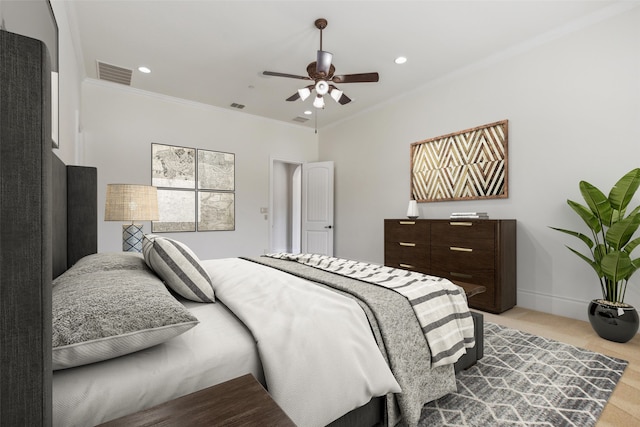 bedroom with crown molding and ceiling fan