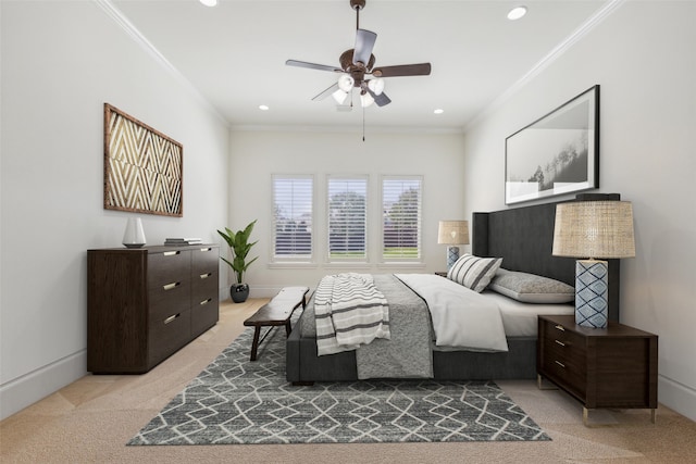 carpeted bedroom featuring ceiling fan and crown molding