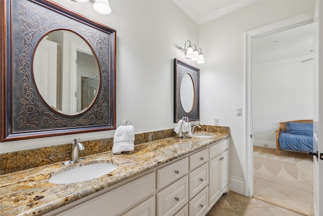 bathroom with vanity, crown molding, and tile patterned floors