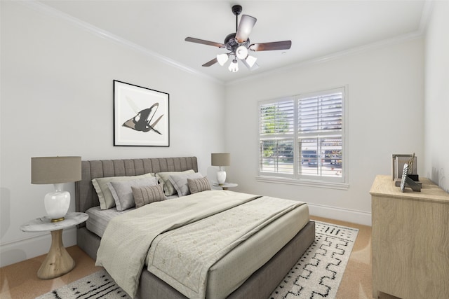 bedroom featuring ceiling fan and ornamental molding