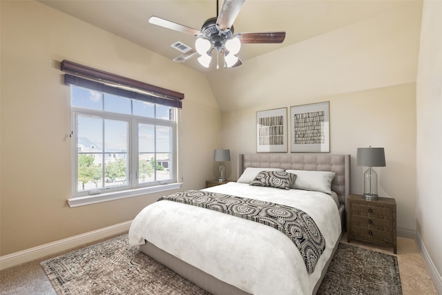 carpeted bedroom with ceiling fan and lofted ceiling