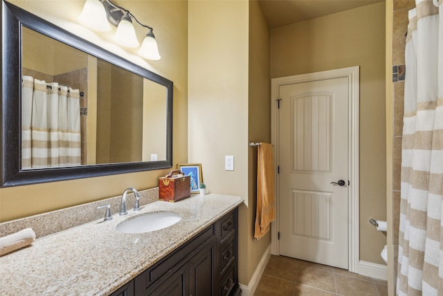 bathroom featuring tile patterned flooring, vanity, toilet, and a shower with shower curtain