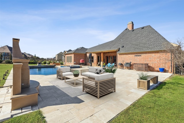 view of swimming pool with an outdoor hangout area, a patio, and a yard