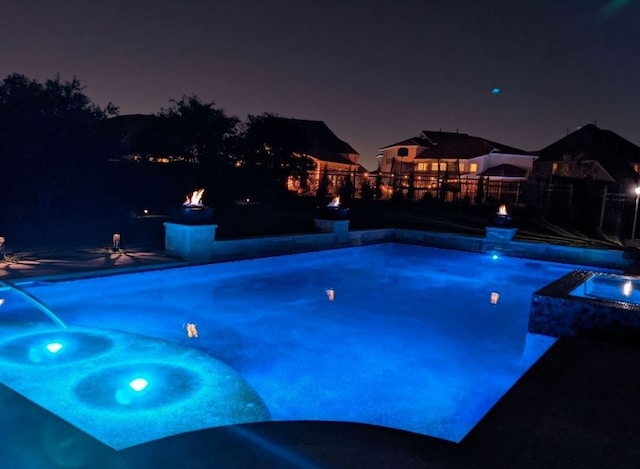 view of pool with an in ground hot tub