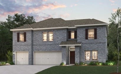 view of front of house featuring a yard and a garage