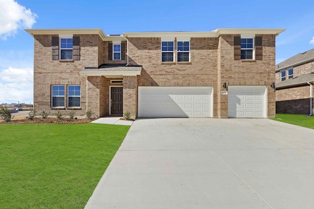 view of front facade with a garage and a front lawn