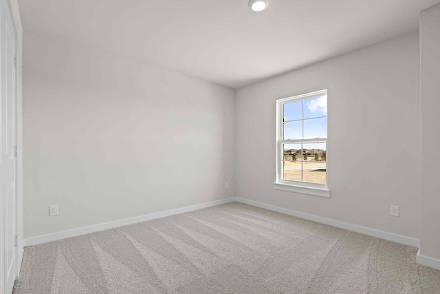 empty room with light colored carpet